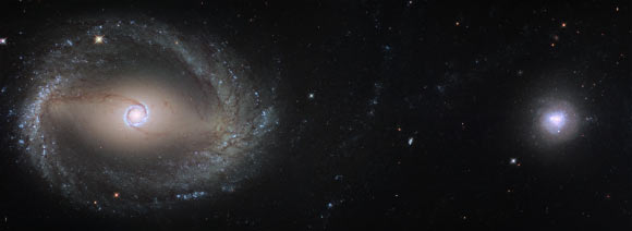 This composite image shows the barred spiral galaxy NGC 1512 (left) and the elliptical galaxy NGC 1510 (right). Image credit: NASA / ESA / Hubble.