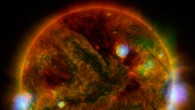 Flaring, active regions of the Sun are highlighted in this image combining observations from several telescopes. High-energy X-rays from NASA’s Nuclear Spectroscopic Telescope Array (NuSTAR) are shown in blue; low-energy X-rays from Japan’s Hinode spacecraft are green; and extreme ultraviolet light from NASA’s Solar Dynamics Observatory (SDO) is yellow and red. All three telescopes captured their solar images around the same time on April 29, 2015. Image credit: NASA / JPL-Caltech / GSFC / JAXA.