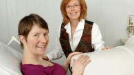 Dr. Gustafson with a mother-to-be in the fetal biomagnetometer. Image credit: University of Kansas.