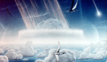 This painting depicts an asteroid slamming into tropical, shallow seas of the sulfur-rich Yucatan Peninsula in what is today southeast Mexico. The aftermath of this immense asteroid collision, which occurred approximately 65 million years ago, is believed to have caused the extinction of the dinosaurs and many other species on Earth. Shown in this painting are pterodactyls, flying reptiles with wingspans of up to 50 feet, gliding above low tropical clouds. Image credit: Donald E. Davis / NASA.