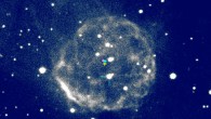 The recovered nova of 1437 and its ejected shell (false color). The now-quiescent star that produced the nova shell is indicated with greenish-blue tick marks; it is far from the shell’s center today. However, its measured motion across the sky places it at the greenish-blue plus sign in 1437. The position of the center of the shell in 2016 and its deduced position in 1437 are indicated with yellow and magenta plus signs, respectively. Image credit: K. Ilkiewicz & J. Mikolajewska.