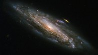 This Hubble image shows the barred spiral galaxy NGC 5559, which lies in the constellation Boötes, about 252 million light-years away. Image credit: NASA / ESA / Hubble.