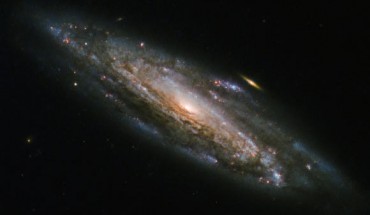 This Hubble image shows the barred spiral galaxy NGC 5559, which lies in the constellation Boötes, about 252 million light-years away. Image credit: NASA / ESA / Hubble.