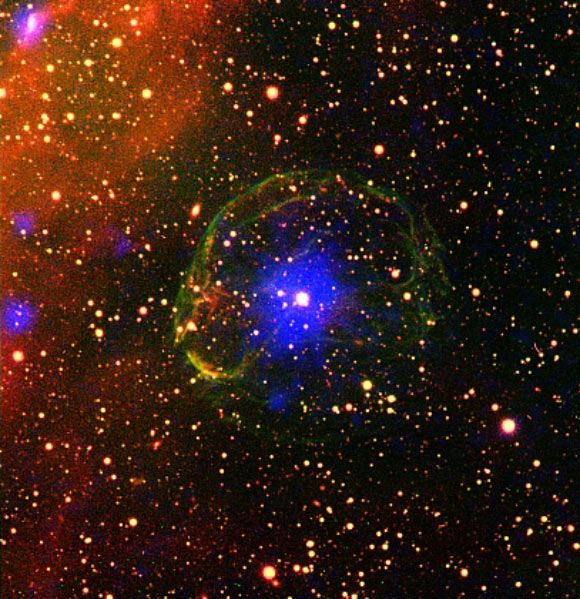 Composite image of the X-ray pulsar SXP 1062 surrounded by the supernova remnant. The false-color image combines X-ray (blue) and optical data (oxygen - green, hydrogen - red). Image credit: ESA / XMM-Newton / L. Oskinova, University of Potsdam / M. Guerrero, Instituto de Astrofisica de Andalucia / Cerro Tololo Inter-American Observatory / R. Gruendl & Y. H. Chu, University of Illinois at Urbana-Champaign.