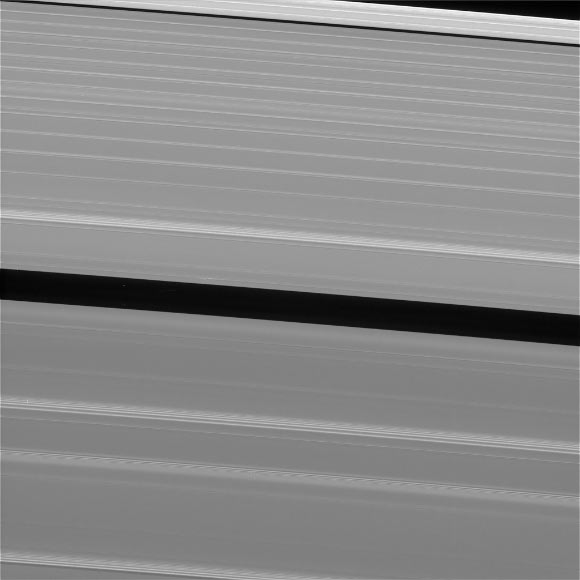 This view of Saturn’s A ring features a lone ‘propeller’ -- one of many such features created by small moonlets embedded in the rings as they attempt, unsuccessfully, to open gaps in the ring material. The image was taken by Cassini on September 13, 2017. The view was taken in visible light using Cassini’s wide-angle camera at a distance of 420,000 miles (676,000 km) from Saturn. Image credit: NASA / JPL-Caltech / Space Science Institute.