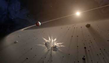 This artist’s rendering shows a giant exoplanet causing small bodies to collide in a disk of dust. Image credit: NASA / JPL-Caltech.