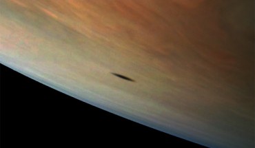 Amalthea casts a shadow on Jupiter in this image captured by NASA’s Juno spacecraft; the elongated shape of the shadow is a result of both the location of Amalthea with relation to Jupiter in this image as well as the irregular shape of the small moon itself. Image credit: NASA / JPL-Caltech / SwRI / MSSS / Gerald Eichstaedt.