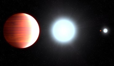 This illustration shows Kepler-13Ab that circles very close to its host star, Kepler-13A. In the background is the star’s binary companion, Kepler-13B, and the third member of the multiple-star system is the orange dwarf star Kepler-13C. Image credit: NASA / ESA / G. Bacon, STScI.