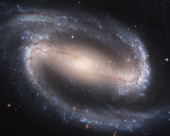 Chakrabarti et al identify an overlooked region that may prove to be rife with orbiting black holes and the origin of gravitational-wave chirps heard by the two Laser Interferometer Gravitational-Wave Observatory (LIGO) detectors in the United States and the Virgo detector in Italy. This Hubble image shows the barred spiral galaxy NGC 1300. Image credit: NASA / ESA / Hubble Heritage Team / STScI / AURA / P. Knezek, WIYN.