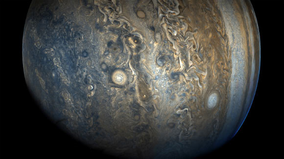 This image of Jupiter’s southern hemisphere was taken by NASA’s Juno spacecraft on October 24 at 2:11 p.m. EDT (11:11 a.m. PDT). At the time the image was taken, Juno was 20,577 miles (33,115 km) from the tops of the clouds of the planet at a latitude of minus 52.96 degrees. The color-enhanced view captures one of the white ovals in the ‘String of Pearls,’ one of eight massive rotating storms at 40 degrees south latitude on the gas giant. Image credit: NASA / JPL-Caltech / SwRI / MSSS / Gerald Eichstaedt / Sean Doran.