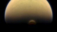 Titan’s south polar vortex stands out against the orange and blue haze layers that are characteristic of the hazy moon’s atmosphere. This view looks towards the trailing hemisphere of Titan (3,200 miles, or 5,150 km across). North on Titan is up and rotated 17 degrees to the left. Images taken using red, green and blue spectral filters were combined to create this natural-color view. The image was taken with the Cassini spacecraft narrow-angle camera on July 30, 2013. The view was acquired at a distance of approximately 895,000 miles (1.441 million km) from Titan. Image credit: NASA / JPL-Caltech / Space Science Institute.