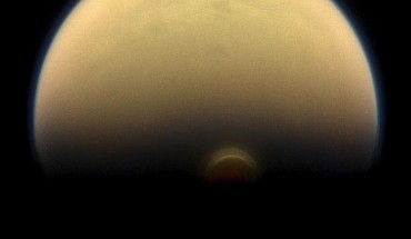 Titan’s south polar vortex stands out against the orange and blue haze layers that are characteristic of the hazy moon’s atmosphere. This view looks towards the trailing hemisphere of Titan (3,200 miles, or 5,150 km across). North on Titan is up and rotated 17 degrees to the left. Images taken using red, green and blue spectral filters were combined to create this natural-color view. The image was taken with the Cassini spacecraft narrow-angle camera on July 30, 2013. The view was acquired at a distance of approximately 895,000 miles (1.441 million km) from Titan. Image credit: NASA / JPL-Caltech / Space Science Institute.