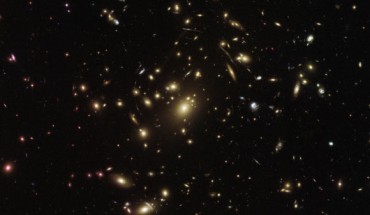 This Hubble image shows the galaxy cluster Abell 2537. The image is a composite of separate exposures acquired by Hubble’s ACS and WFC3 instruments. Five filters were used to sample various wavelengths. The color results from assigning different hues to each monochromatic image associated with an individual filter. Image credit: NASA / ESA / Hubble.