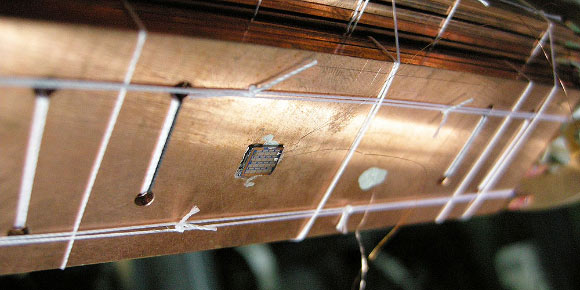 A chip with a Coulomb blockade thermometer on it is prepared for experiments at extremely low temperatures. Image credit: University of Basel.