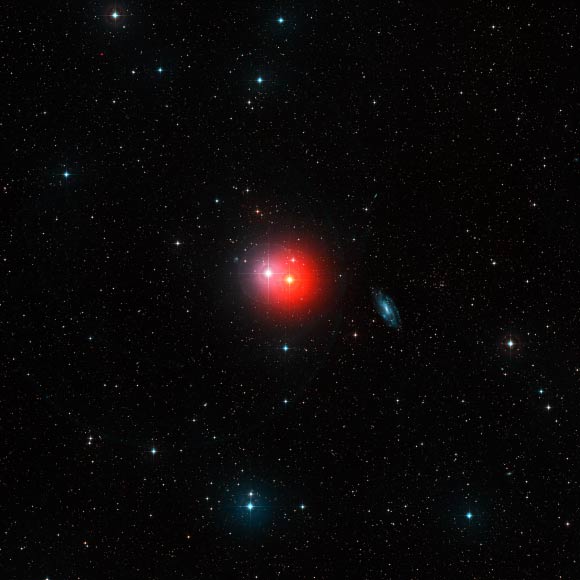 This colorful image shows the sky around the bright pair of stars π1 Gruis (center-right, very red) and π2 Gruis (center-left, bluish-white). Just right of centre the bright spiral galaxy IC 5201 is also visible and many other fainter galaxies are scattered across this wide-field image from the Digitized Sky Survey 2. Image credit: ESO / Digitized Sky Survey 2 / Davide De Martin.