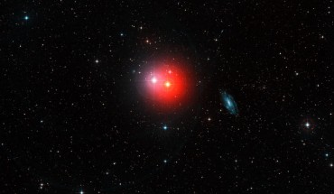 This colorful image shows the sky around the bright pair of stars π1 Gruis (center-right, very red) and π2 Gruis (center-left, bluish-white). Just right of center the bright spiral galaxy IC 5201 is also visible and many other fainter galaxies are scattered across this wide-field image from the Digitized Sky Survey 2. Image credit: ESO / Digitized Sky Survey 2 / Davide De Martin.