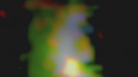 This image shows the galaxy 3C 298, located approximately 9.3 billion light-years away. The green colors highlight the energetic gas across the galaxy that is being illuminated by the quasar. The blue color represents powerful winds blowing throughout the galaxy. The red-orange colors represent the cold molecular gas in the system. The supermassive black hole sits at the center of the bright red-orange circular area slightly below the middle of the image. Image credit: Vayner et al.