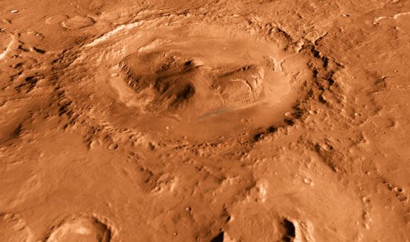Gale Crater is 96 miles (154 km) in diameter and holds a layered mountain rising about 3 miles (5 km) above the crater floor. Image credit: NASA / JPL-Caltech / ASU / UA.