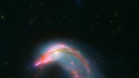 This composite image shows two interacting galaxies, known collectively as Arp 142. NGC 2936, once a standard spiral galaxy, and NGC 2937, a smaller elliptical, bear a striking resemblance to a penguin guarding its egg. The blue streak at the top of the image is an unrelated background galaxy, UGC 5130. Image credit: NASA-ESA / STScI / AURA / JPL-Caltech.