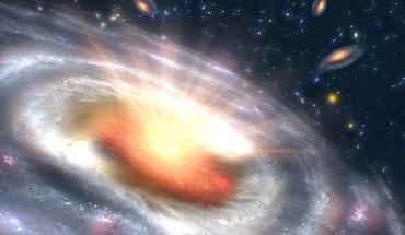 A massive black hole can be seen at the center of a faraway galaxy in this artist’s concept. Image credit: NASA / JPL-Caltech.
