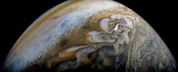 This color-enhanced image shows swirling cloud formations in the northern area of Jupiter’s north temperate belt. The image was taken on February 7 at 8:42 a.m. EST (5:42 a.m. PST), as Juno performed its eleventh close flyby of Jupiter. At the time the image was taken, the spacecraft was about 5,086 miles (8,186 km) from the tops of the clouds of the planet at a latitude of 39.9 degrees. Citizen scientist Kevin M. Gill processed this image using data from the JunoCam imager. Image credit: NASA / JPL-Caltech / SwRI / MSSS / Kevin M. Gill.