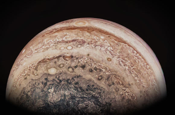 This JunoCam image shows most of Jupiter’s south pole and southern areas, where a huge amount of storms is visible across the atmosphere. The image has been processed to show Jupiter close to natural color. Image credit: NASA / JPL / SwRI / MSSS / Astrobitacora / Alex Riveiro.