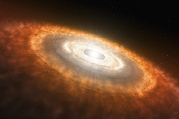 Artist’s impression of an infant star still surrounded by a protoplanetary disk in which planets are forming. Image credit: L. Calçada / ESO.