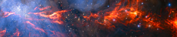 This spectacular image shows part of the Orion Nebula. It combines a mosaic of millimeter-wavelength images from ALMA and IRAM telescopes, shown in red, with a more familiar infrared view from the HAWK-I instrument on ESO’s Very Large Telescope, shown in blue. Image credit: ESO / H. Drass / ALMA / NAOJ / NRAO / A. Hacar.