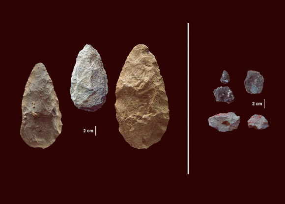 The first evidence of human life in the Olorgesailie Basin comes from about 1.2 million years ago. For hundreds of the thousands of years, people living there made and used large stone-cutting tools called handaxes (left). According to three new studies, early humans in East Africa had -- by about 320,000 years ago -- begun using color pigments and manufacturing more sophisticated tools (right) than those of the Early Stone Age handaxes, tens of thousands of years earlier than previous evidence has shown in eastern Africa. The sophisticated tools (right) were carefully crafted and more specialized than the large, all-purpose handaxes (left). Many were points designed to be attached to a shaft and potentially used as projectile weapons, while others were shaped as scrapers or awls. Image credit: Human Origins Program, Smithsonian.