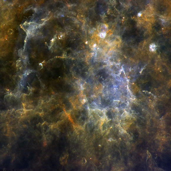 Chaotic web of gas filaments and dark bubbles in a Milky Way stellar nursery. Image credit: ESA / Herschel / PACS / SPIRE / Hi-GAL Project / UNIMAP / L. Piazzo, La Sapienza - Università di Roma / E. Schisano / G. Li Causi, IAPS & INAF.