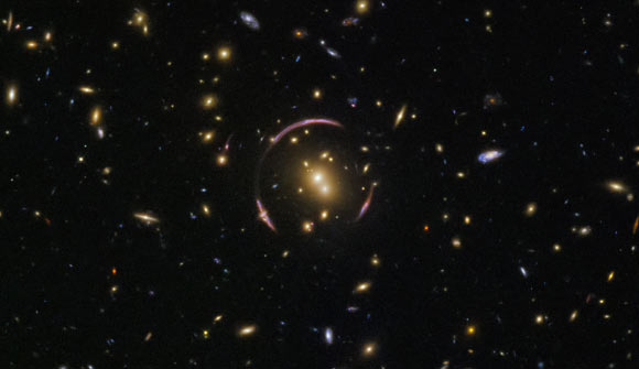 This is an image of the gravitational lens system SDSS J0146-0929 as photographed by Hubble. Image credit: NASA / ESA / Hubble / Judy Schmidt, www.geckzilla.com.