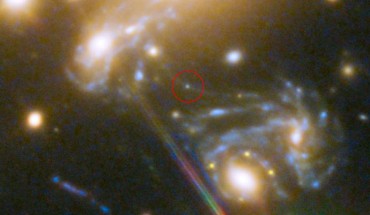 This Hubble image shows the galaxy cluster MACS J1149.5+223, whose light has taken over 5 billion years to reach us. Highlighted is the position where the Icarus star appeared -- its image magnified by a factor 2,000 by gravitational microlensing. The spiral galaxy in which the star is located can be seen three times on the sky -- multiplied by strong gravitational lensing. Image credit: NASA / ESA / S. Rodney, John Hopkins University / FrontierSN Team / T. Treu, University of California Los Angeles / P. Kelly, University of California Berkeley / GLASS Team / J. Lotz, STScI / Frontier Fields Team / M. Postman, STScI / CLASH Team / Z. Levay, STScI.