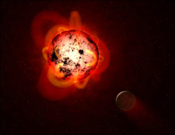 This illustration shows a red dwarf star orbited by a hypothetical exoplanet. Red dwarfs tend to be magnetically active, displaying gigantic arcing prominences and a wealth of dark sunspots. Red dwarfs also erupt with intense flares that could strip a nearby planet’s atmosphere over time, or make the surface inhospitable to life as we know it. Image credit: NASA / ESA / STScI / G. Bacon.