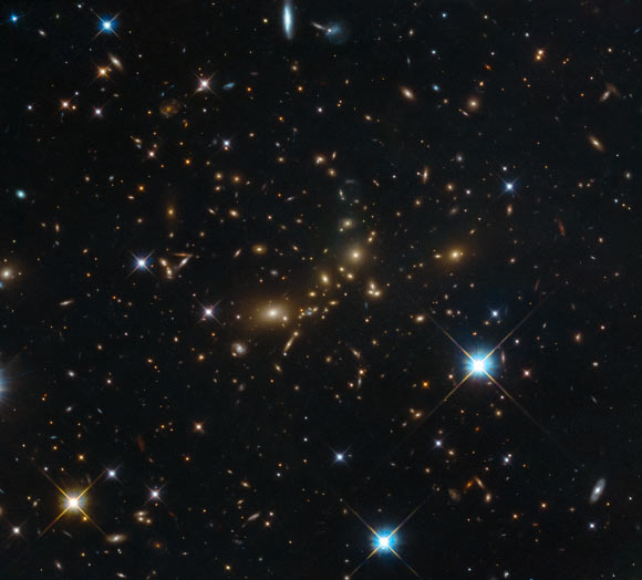 This Hubble image shows PLCK G308.3-20.2, a massive galaxy cluster that lies 5 billion light-years away from Earth. Image credit: NASA / ESA / Hubble / RELICS.