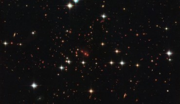 This Hubble image shows the distant and massive galaxy cluster that is officially known as PSZ2 G138.61-10.84. Image credit: NASA / ESA / Hubble / RELICS.