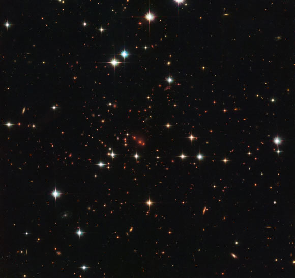This Hubble image shows the distant and massive galaxy cluster that is officially known as PSZ2 G138.61-10.84. Image credit: NASA / ESA / Hubble / RELICS.