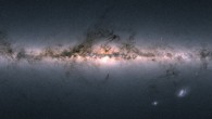 Gaia’s all-sky view of our Milky Way Galaxy and neighboring galaxies, based on measurements of nearly 1.7 billion stars. Brighter regions indicate denser concentrations of especially bright stars, while darker regions correspond to patches of the sky where fewer bright stars are observed. The color representation is obtained by combining the total amount of light with the amount of blue and red light recorded by Gaia in each patch of the sky. The bright horizontal structure that dominates the image is the Galactic plane, the flattened disc that hosts most of the stars in our home Galaxy. In the middle of the image, the Galactic center appears vivid and teeming with stars. Darker regions across the Galactic plane correspond to foreground clouds of interstellar gas and dust, which absorb the light of stars located further away, behind the clouds. Many of these conceal stellar nurseries where new generations of stars are being born. Sprinkled across the image are also many globular and open clusters -- groupings of stars held together by their mutual gravity, as well as entire galaxies beyond our own. The two bright objects in the lower right of the image are the Large and Small Magellanic Clouds, two dwarf galaxies orbiting the Milky Way. In small areas of the image where no color information was available -- to the lower left of the Galactic center, to the upper left of the Small Magellanic Cloud, and in the top portion of the map -- an equivalent grayscale value was assigned. Image credit: ESA / Gaia / DPAC.