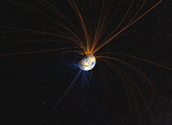 Earth’s magnetic field connects the North Pole (orange lines) with the South Pole (blue lines) in this NASA-created image. Image credit: NASA’s Goddard Space Flight Center.