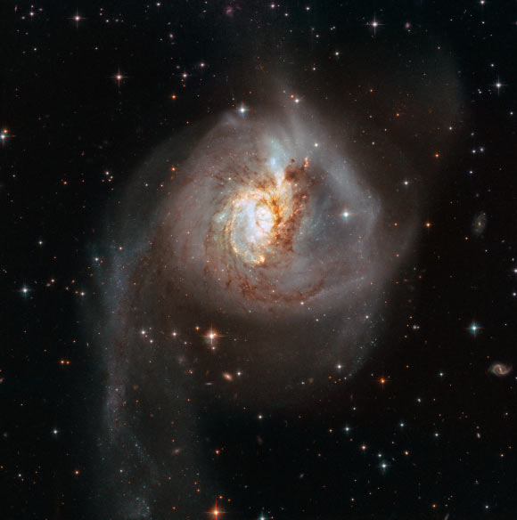 This image, taken with Hubble’s Wide Field Camera 3 (WFC3) and the Advanced Camera for Surveys (ACS) instruments, shows a peculiar galaxy called NGC 3256 -- the result of a past galactic merger, which created the galaxy’s distorted appearance. Image credit: NASA / ESA / Hubble.