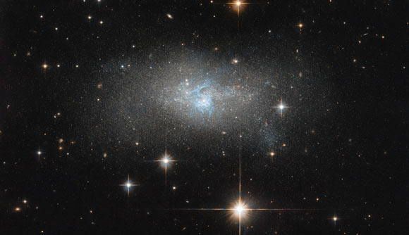 This Hubble image shows the dwarf galaxy IC 4870. Image credit: NASA / ESA / Hubble.
