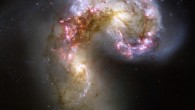 This celestial firestorm is the blazing wreckage of a collision between two spiral galaxies NGC 4038 and NGC 4039, which are located about 62 million light-years from Earth. The two galaxies, whose bright yellow cores appear to the lower left and upper right of center, began their fateful confrontation a few hundred million years ago. The pair is nicknamed the Antennae Galaxies because of two long streamers of stars, gas, and dust that extend from the crash site. Wide-field images reveal the elongated ‘antennae’ formed during the initial impact, but this Hubble image concentrates on the heart of the galactic collision. Image credit: NASA / ESA / B. Whitmore, STScI.