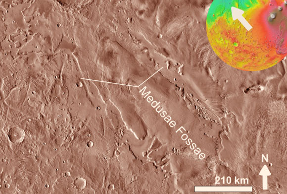 The Medusae Fossae Formation is one of the largest sedimentary deposits on Mars. This is an infrared image mosaic generated using Thermal Emission Imaging System (THEMIS) images from NASA’s Mars Odyssey orbiter mission; the small colored globe based on the Mars Orbiter Laser Altimeter (MOLA). Image credit: NASA.