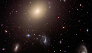This Hubble image shows the diverse collection of galaxies in the galaxy cluster Abell S0740. The giant elliptical galaxy ESO 325-G004 looms large at the cluster’s center. Image credit: NASA / ESA / Hubble Heritage Team / STScI / AURA / J. Blakeslee, Washington State University.