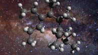 An illustration of the structure of a greasy carbon molecule, set against an image of the Milky Way’s center, where this material has been detected; carbon is represented as gray spheres and hydrogen as white spheres. Image credit: D. Young.
