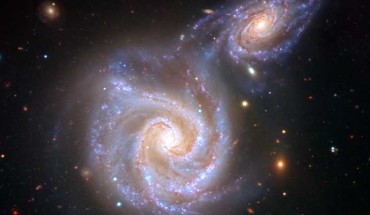 An impression of the encounter between the Milky Way and the Sausage dwarf galaxy. Image credit: V. Belokurov / Juan Carlos Muñoz / ESO.