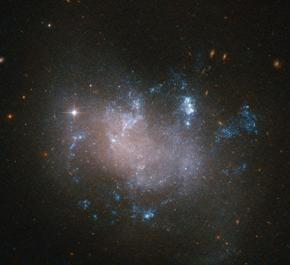 This Hubble image shows the irregular galaxy UGC 12682. Image credit: NASA / ESA / Hubble.