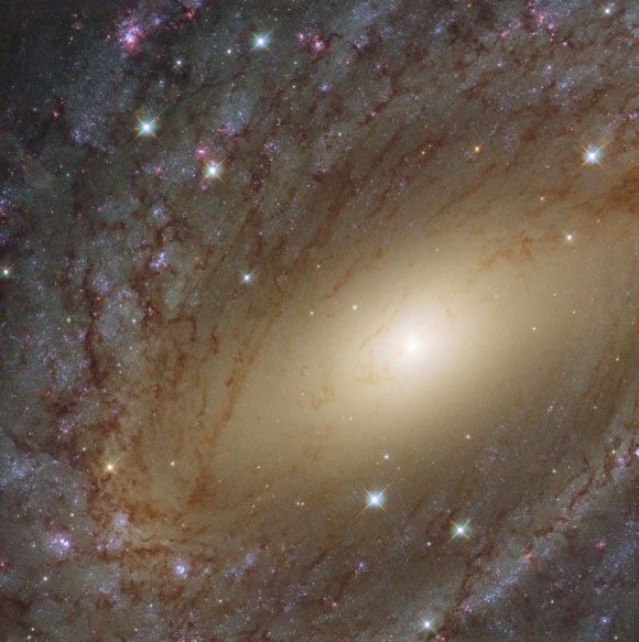 This color image of NGC 6744 was made from separate exposures taken in the visible, ultraviolet and infrared regions of the spectrum with Hubble’s Wide Field Camera 3 (WFC3). Seven filters were used to sample various wavelengths. The color results from assigning different hues to each monochromatic image associated with an individual filter. Image credit: NASA / ESA / Hubble / Judy Schmidt.
