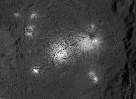 This close-up image of Vinalia Faculae in Occator crater was obtained by the Dawn spacecraft in its second extended mission. This image reveals the intricate pattern between bright and dark material across this flow feature, which scientists will use to infer the history of this area, in particular the role of the fractures in the exposure of bright salts onto the surface. The center of this picture is located at about 20.2 degrees north latitude and 242.0 degrees east longitude. Image credit: NASA / JPL-Caltech / UCLA / MPS / DLR / IDA / PSI.