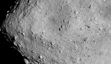 Hayabusa-2 image of the asteroid Ryugu as seen from a distance of 3.7 miles. A particularly large crater is visible near the center of the image. Image credit: JAXA / University of Tokyo / Kochi University / Rikkyo University / Nagoya University / Chiba Institute of Technology / Meiji University / University of Aizu / AIST.