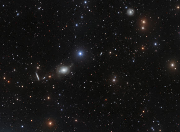 This deep image of the area of sky around the elliptical galaxy NGC 5018 offers a spectacular view of its tenuous streams of stars and gas. These delicate features are hallmarks of galactic interactions, and provide vital clues to the structure and dynamics of early-type galaxies. Image credit: Spavone et al / ESO.
